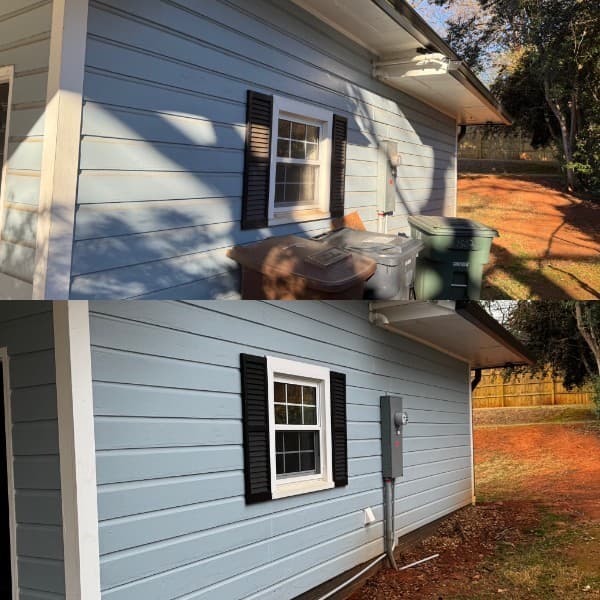 Before and after pressure washing on light blue house siding in Greensboro, NC