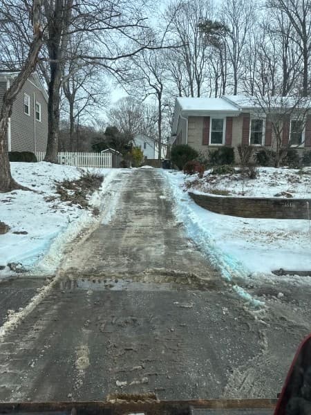 Snow removal on a residential driveway in Greensboro, NC after a winter storm