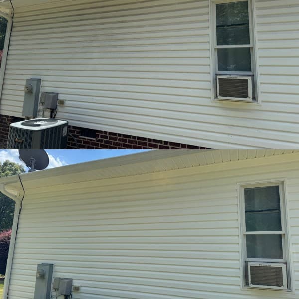 Before and after soft washing of vinyl siding on a home in Greensboro, NC